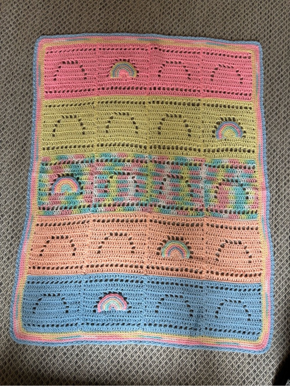 Vintage crocheted rainbow baby blanket